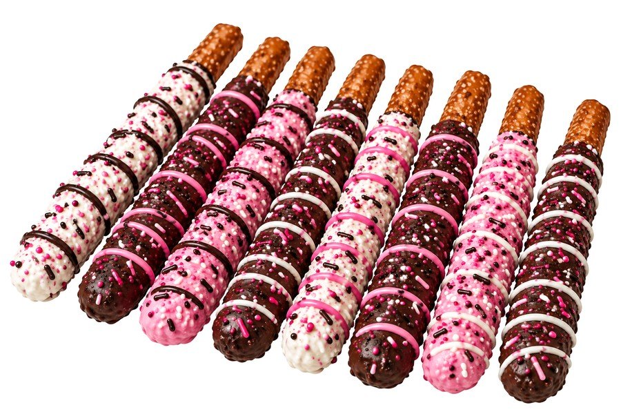 Eight dipped pretzel sticks with assorted drizzles and sprinkles